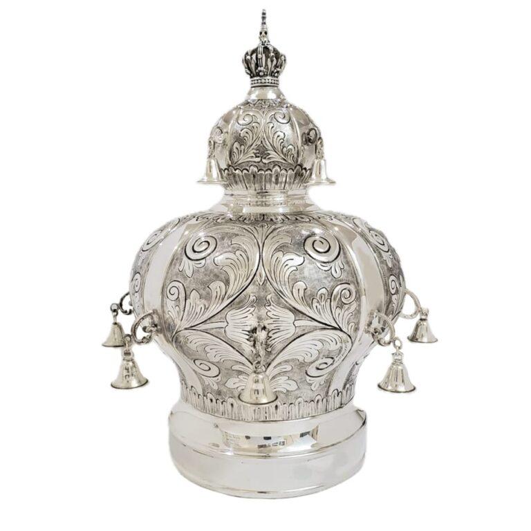 Ornate silver torah crown with hand chased flourishes