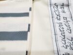 Keter Tallit Tashbetz. Close-up view of Atarah with Textured Weave. Non-slip fabric with elegant Gray and Silver Stripes